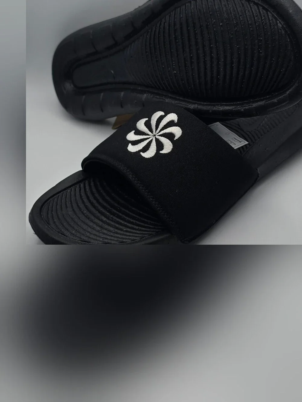 Nike Victori One Black Slide Sandals with White Floral Logo